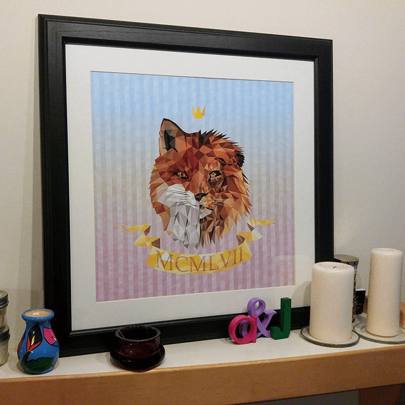 Framed geometric anniversary artwork displayed on a mantle
